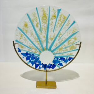 Blue rising sun on glass fusion stand